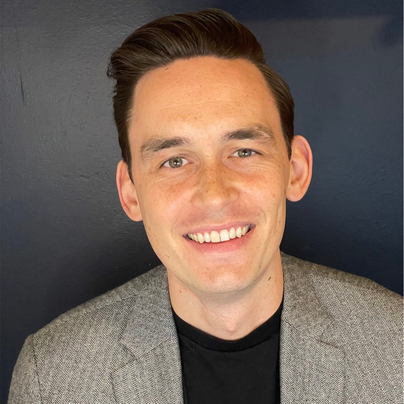 Jake Canull, Regional Director Top Employers Institute seen posing for a photo with a smile on his face
